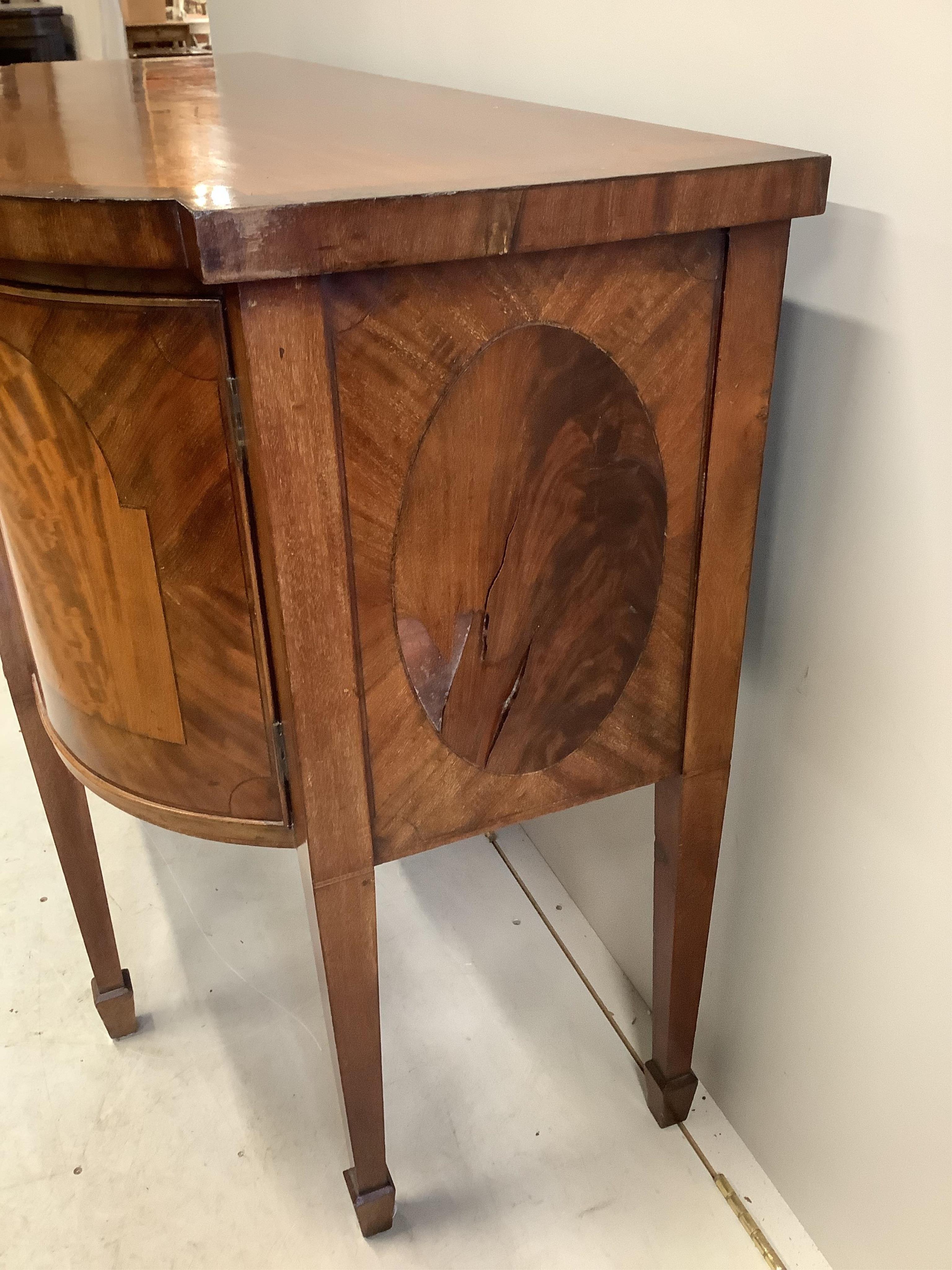 A George IV mahogany bow front sideboard, width 150cm, depth 57cm, height 95cm. Condition - poor to fair